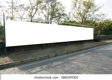 Empty white horizontal wide billboards at the roadside for mock up. - Shutterstock ID 1885399303