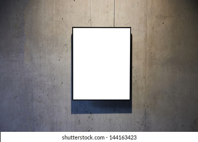 Empty white isolated frame on the wall