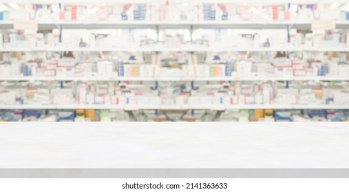 Empty White Marble Counter Top With Blur Pharmacy Drugstore Shelves Background