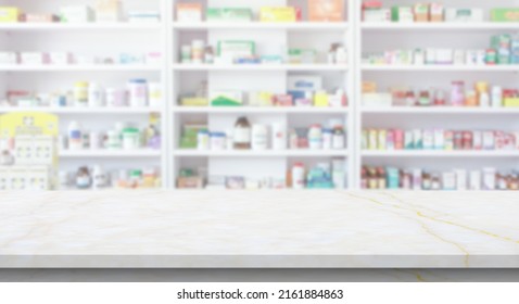 Empty white marble counter top with blur pharmacy drugstore shelves background - Shutterstock ID 2161884863