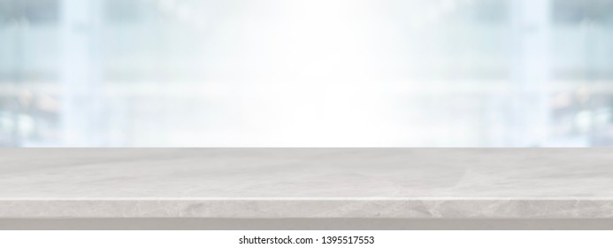 Empty white marble stone table top on blurred with bokeh shopping mall and restaurent interior banner background - can be used for display or montage your product. - Shutterstock ID 1395517553