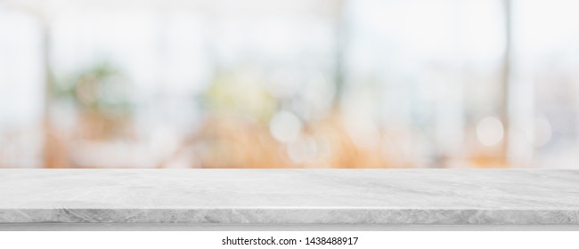 Empty white marble stone table top on blurred with bokeh cafe and restaurent interior banner background - can be used for display or montage your products - Shutterstock ID 1438488917