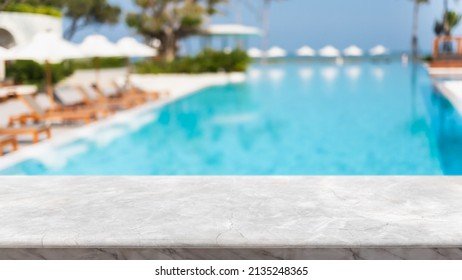 Empty white marble stone table top and blurred swimming pool in tropical resort in summer banner background - can used for display or montage your products. - Shutterstock ID 2135248365