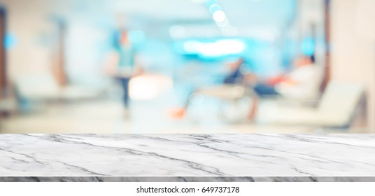 Empty White Marble Table Top View With Blurred Patient At Hospital Background,Mock Up Template For Display Or Montage Of Your Design,Banner For Advertise Of Product,panorama View