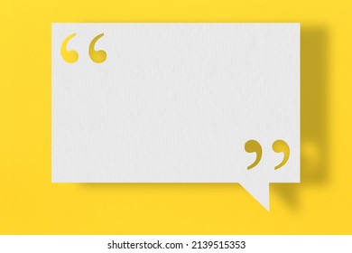 Empty white note paper floating on yellow art paper background and have quotation mark for design in your work.