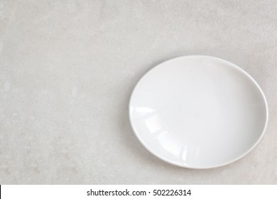 Empty White Oval Plate On Marble.  Top View.