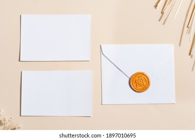 Empty White Paper Mock Up With Leaves On Beige Background. Holiday Marketing, Business Card And Email Newsletter Concept.