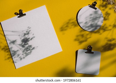 Empty White Paper Mock Up On Bright Yellow Background With Floral Shadows. Holiday Marketing, Business Card And Email Newsletter Concept.
