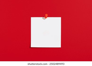 Empty white paper sheet for notes with pin on a red background. Office and school supplies on a red background. Back to school concept, top view - Powered by Shutterstock