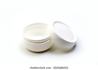 Empty White Plastic Opaque Cream Jar With Lid. Isolated On White Background. Cosmetic Product For Skin Care