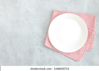 Empty White Plate On Black Grey And Napkin. Food Background For Menu, Recipe. Table Setting. Flatlay, Top View. Mockup For Restaurant Dish