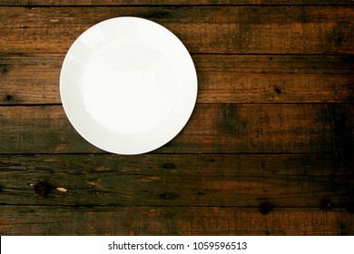 Empty White Plate On Wood Background, Top View 