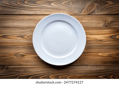 Empty white plate on wooden background, Top view - Powered by Shutterstock