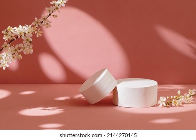 Empty white podiums with flowers on pastel pink background. Minimal geometric podium. Mockup. - Shutterstock ID 2144270145