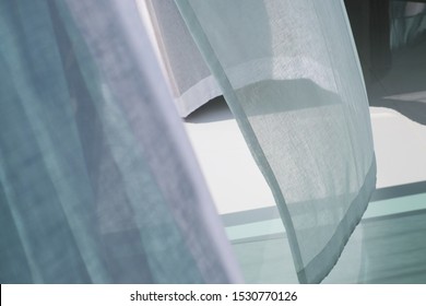 Empty white room with curtains on windows, white room interior with waving curtain by fresh air, White curtain blown by wind and gray color ceramic floor tiles texture. - Shutterstock ID 1530770126