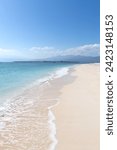 Empty white sandy beach with clear waters, Gili Islands, Indonesia