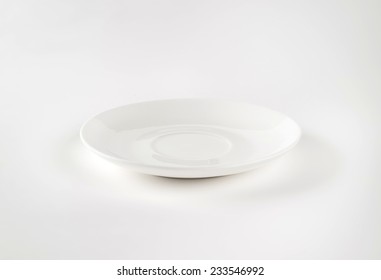 Empty White Saucer On White Background