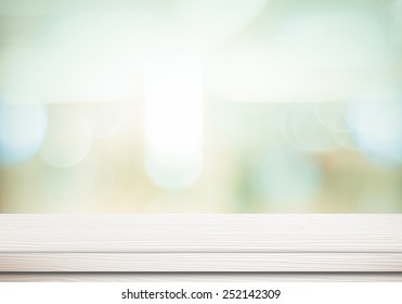 Empty white table and blurred abstract background with bokeh light