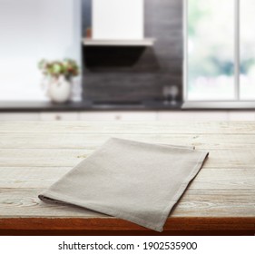 Empty White Table Cloth On Wooden Desk Mockup. Kitchen Background. Selective Focus.