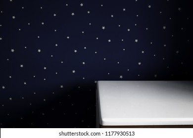 Empty White Table And Night Sky Starry Wall In Kids Bedroom