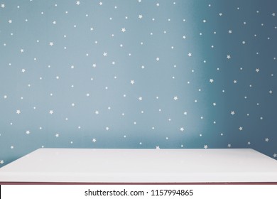 Empty White Table And Soft Grey Blue Starry Wall In Kids Room. 