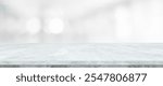 Empty white table top, counter, desk background over blur abstract bokeh light background, White marble stone table, shelf and blurred white backgroundt for food, product display mockup, template