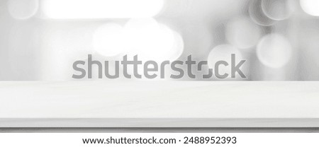 Empty white table top, counter, desk over blur monochrome store with bokeh background, White marble stone shelf for food, product display mockup, template backdrop, banner, Retail business wallpaper