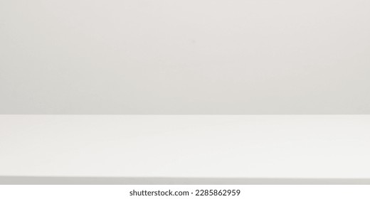 Empty white table top, mock up, white desk and white background. - Shutterstock ID 2285862959