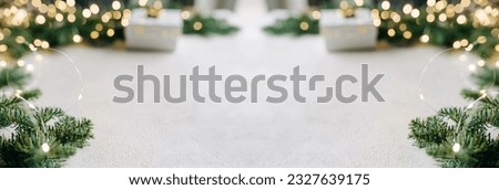 Empty white wold table top with abstract warm living room decor with christmas tree string light blur background with snow,Holiday backdrop,Mock up banner for display of advertise product