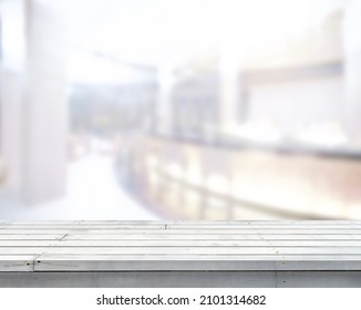 Empty White Wooden Tabletop With Blur Image Of A Counter Bar In The Hotel Or Bar Interior Luxury Lobby In The Daytime Background, Copy Space For Your Text Ready For Product Promotion Display Montage.