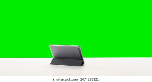 Empty White Working Table With Tablet Gadget isolated on green screen