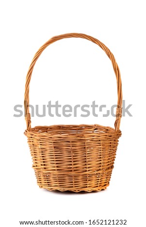 Empty wicker basket for fruits and vegetables, isolated on white