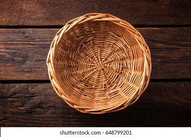 Empty Wicker Basket On A Wooden Background, Top View