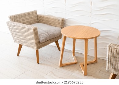 Empty Wicker Sofa With Table With White Wall