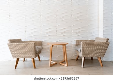 Empty Wicker Sofa With Table With White Wall