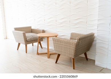 Empty Wicker Sofa With Table With White Wall