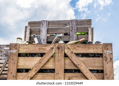 Empty wine bottles stacked in wine boxes.