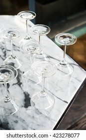 Empty wine glass on marble table