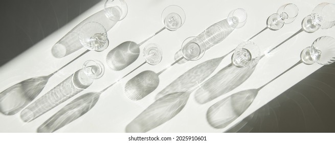 Empty Wine Glasses On White Background With Shades, Top View