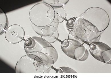 Empty Wine Glasses Top View On White Table With Dark Shadow Winery Production Wine Degustation Concept