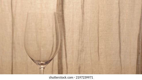 Empty Wineglass With Curtains On Background, Wide Photo