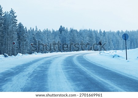 empty winter road, snow background in the surrounding landscape
