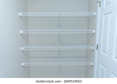 Empty Wire Shelving Storage In An Empty Closet.