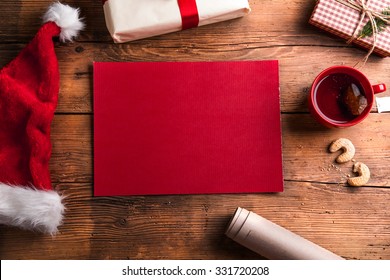 Empty wishlist for Santa Claus laid on a wooden table