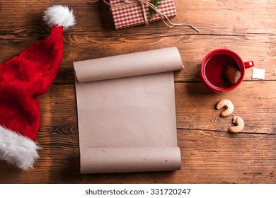 Empty wishlist for Santa Claus laid on a wooden table - Powered by Shutterstock