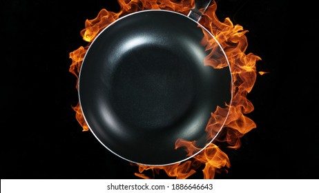 Empty Wok Pan, Flames On Background. High Angle View Of Meal Preparation, Studio Shot.