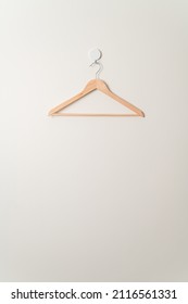 empty wood clothes hanger on wall