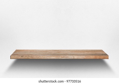 Empty wood shelf on wall
