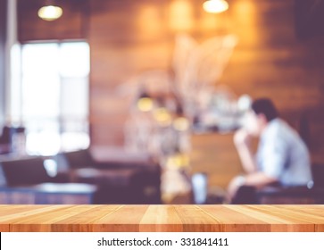 Empty Wood Table With Blur Coffee Shop Background,Mock Up Template For Display Of Product