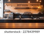 Empty wood table with blur interior coffee shop restaurant or cafe for background.